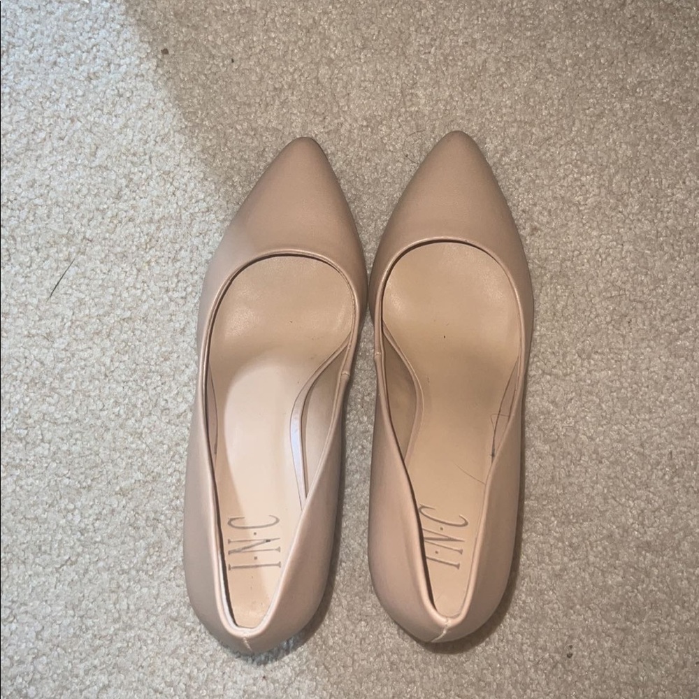 Tan heels. Worn once and in very good condition. Not wide.